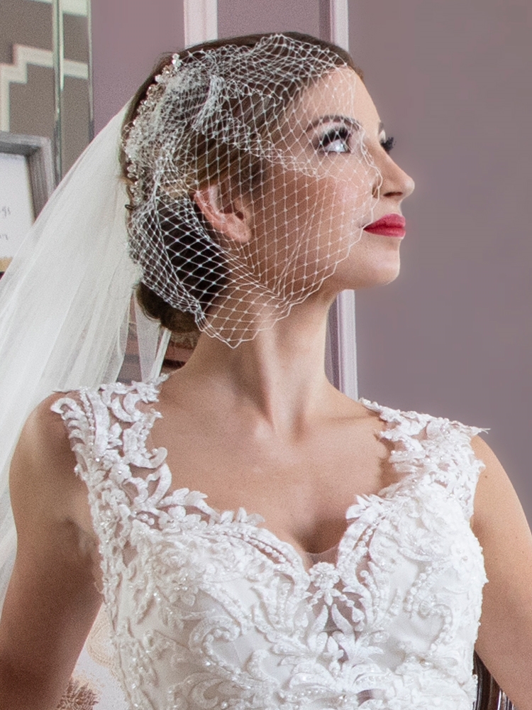 Bridal pearls hair piece with short birdcage veil for store bride